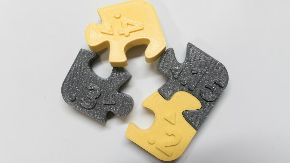 Yellow and gray interlocking printed fit samples with different labeled clearances