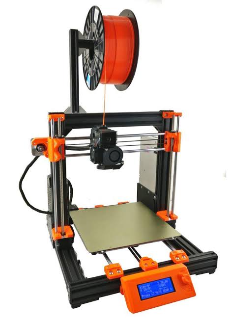 Desktop FDM 3D printer with a filament spool, print head, and build plate