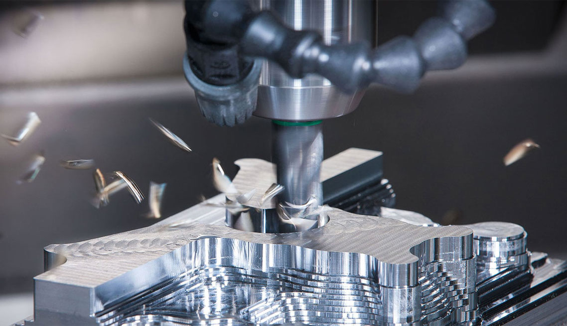 A milling cutter removing aluminum and producing metal chips